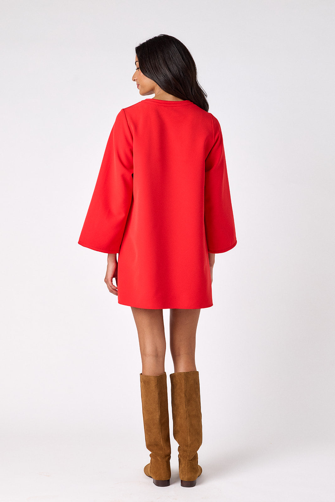 Carnelian above-the-knee tunic dress with bell sleeves on model – CROSBY by Mollie Burch