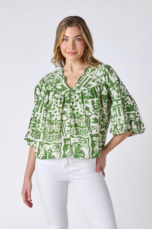 Gardener cotton top with scallop neckline and button-down front on model — CROSBY by Mollie Burch