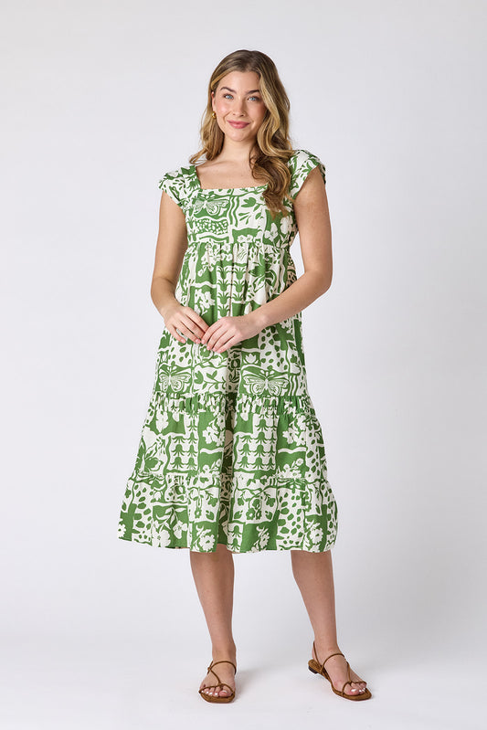 Gardener midi dress with square neckline and tiered skirt on model — CROSBY by Mollie Burch