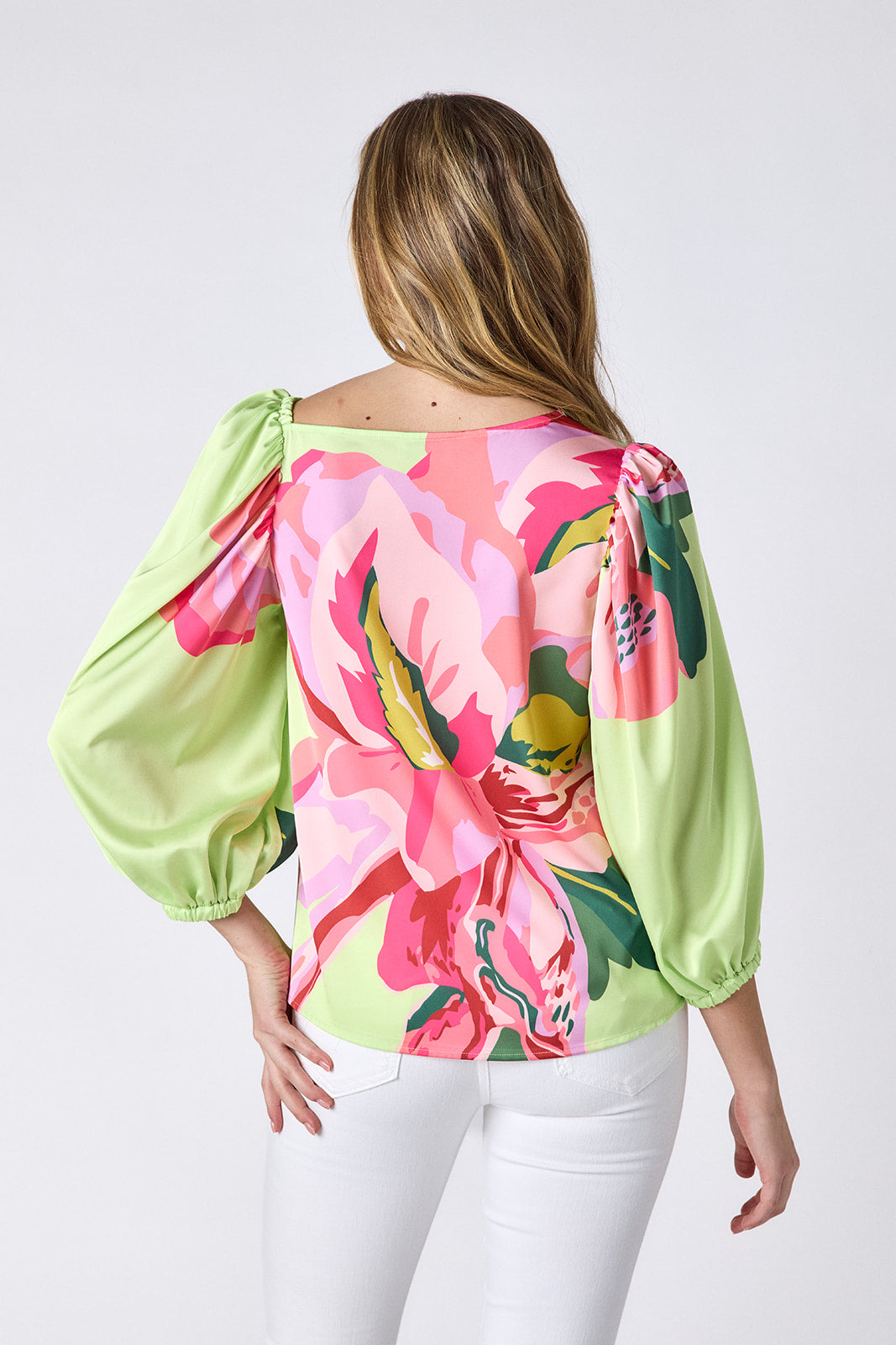 Orchid 3/4 sleeve top with asymmetrical neckline on model — CROSBY by Mollie Burch