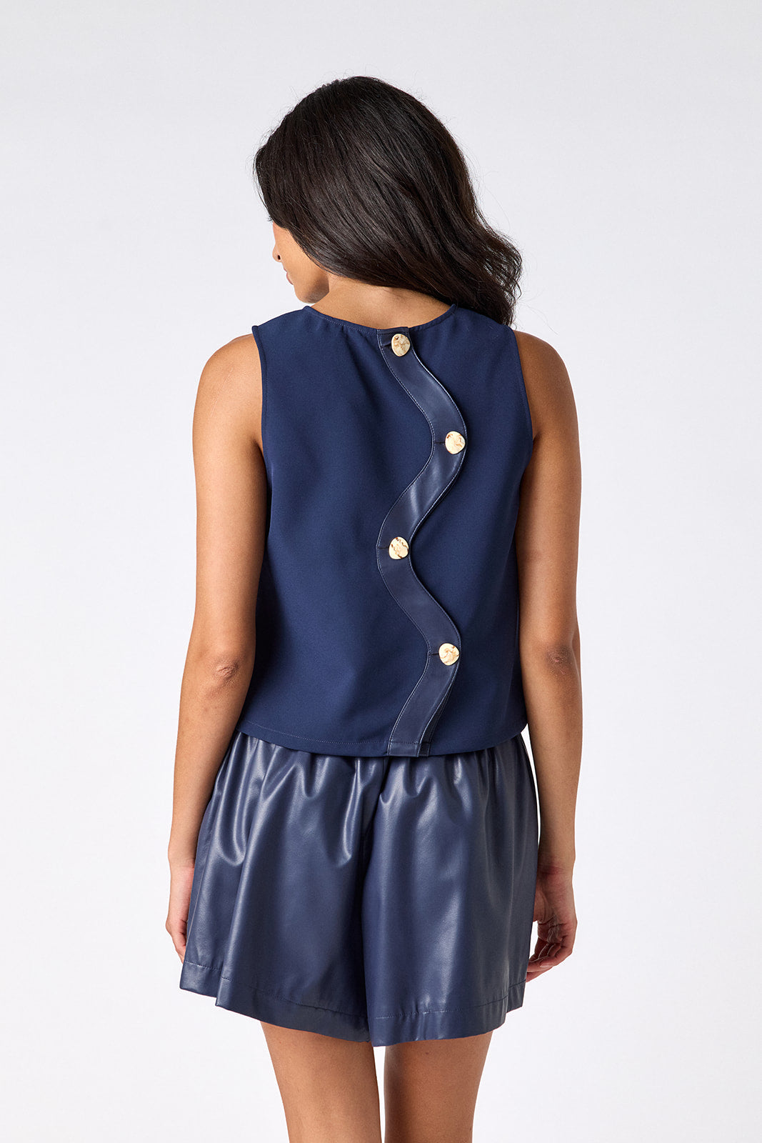 Oxford Navy leather shorts with matching boxy tank on model — CROSBY by Mollie Burch