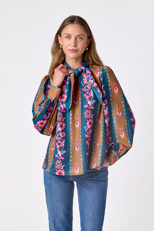 Tapestry Stripe flowy long-sleeve top with tie neck detail on model – CROSBY by Mollie Burch