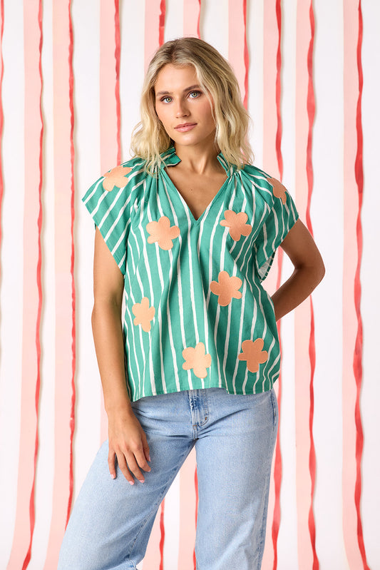 Veranda Stripe raglan style short sleeve top with embroidered flowers on model — CROSBY by Mollie Burch