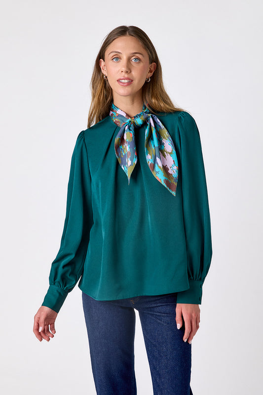 Verdigris flowy long-sleeve top with tie neck detail on model – CROSBY by Mollie Burch