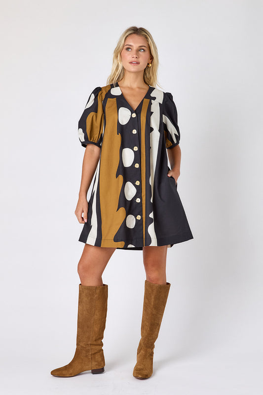 Wild Line v-neck dress with puff sleeves and a swingy silhouette on model — CROSBY by Mollie Burch