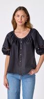 Black button front top with balloon sleeves and fagoting detail on model — CROSBY by Mollie Burch
