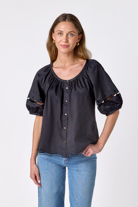 Black button front top with balloon sleeves and fagoting detail on model — CROSBY by Mollie Burch