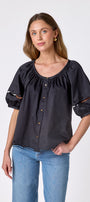 Black button front top with balloon sleeves and fagoting detail on model — CROSBY by Mollie Burch