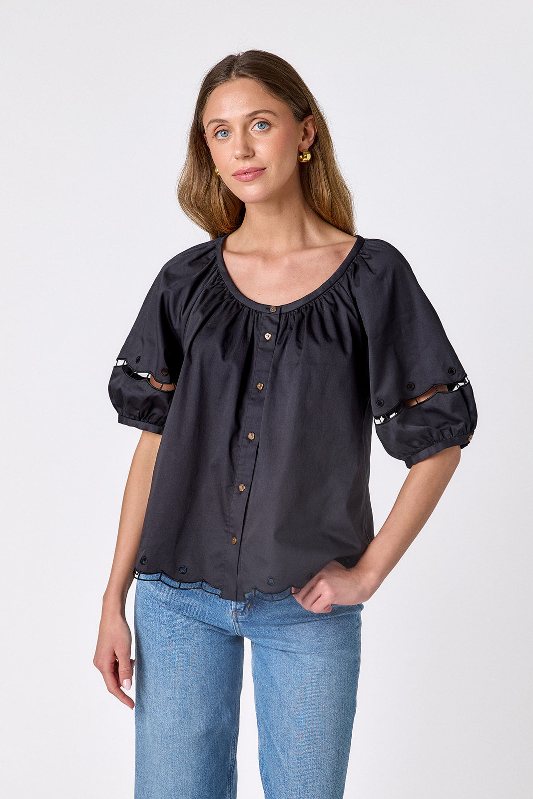 Black button front top with balloon sleeves and fagoting detail on model — CROSBY by Mollie Burch