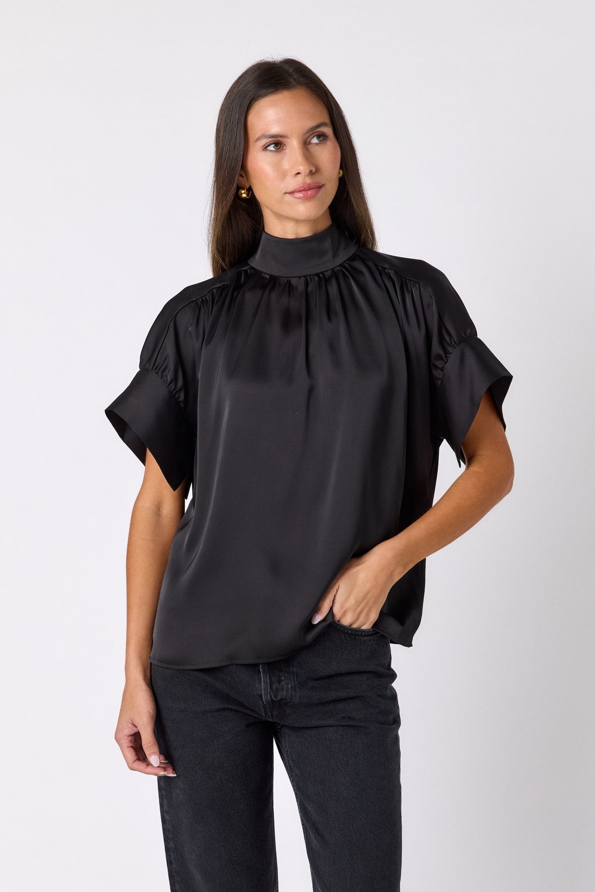 Black Lillian Top with short sleeves and versatile scarf detailing on model – CROSBY by Mollie Burch