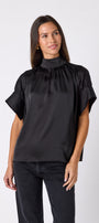 Black Lillian Top with short sleeves and versatile scarf detailing on model – CROSBY by Mollie Burch