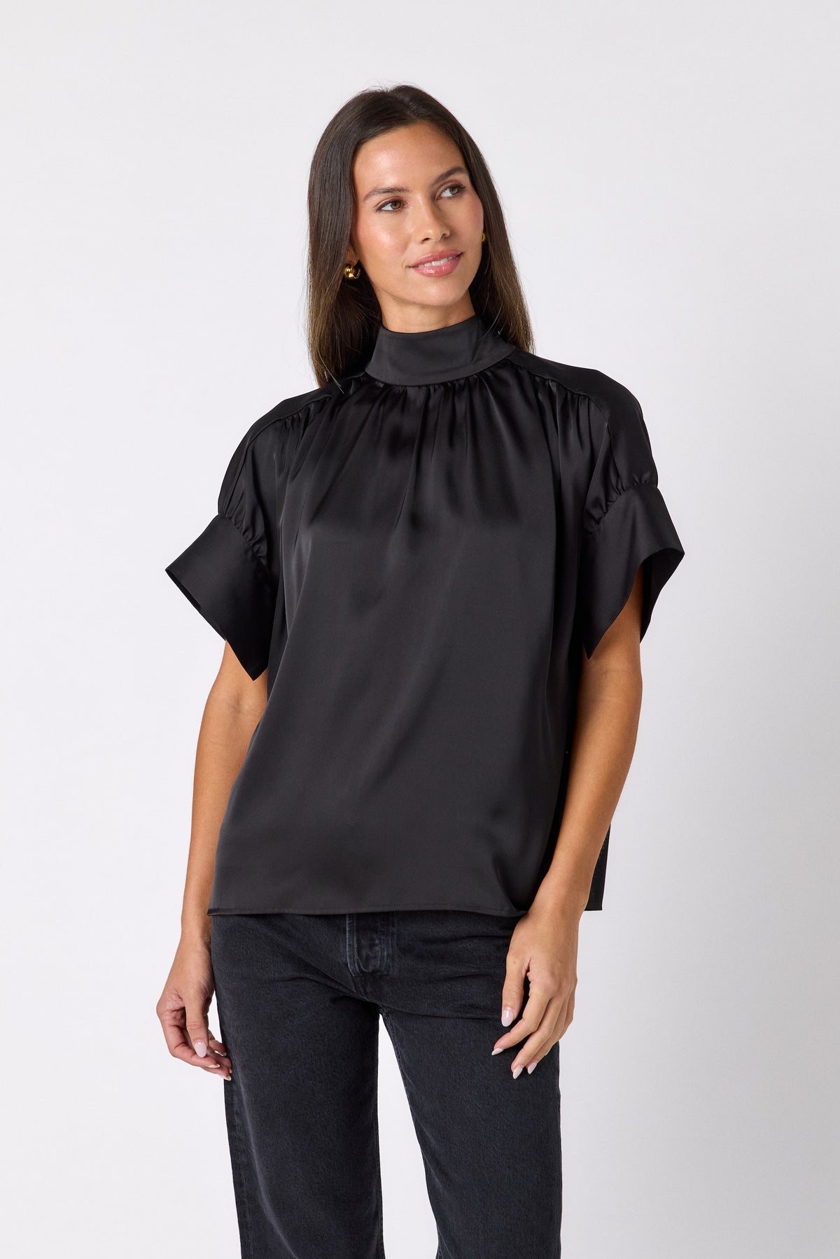 Black Lillian Top with short sleeves and versatile scarf detailing on model – CROSBY by Mollie Burch