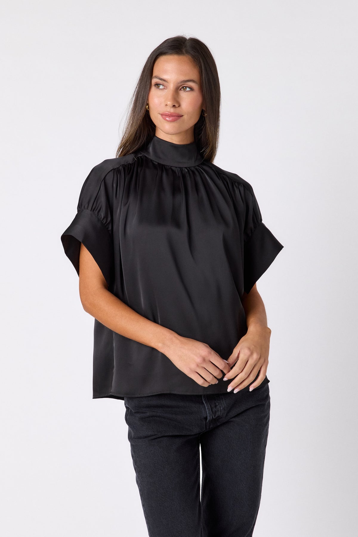 Black Lillian Top with short sleeves and versatile scarf detailing on model – CROSBY by Mollie Burch