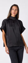 Black Lillian Top with short sleeves and versatile scarf detailing on model – CROSBY by Mollie Burch