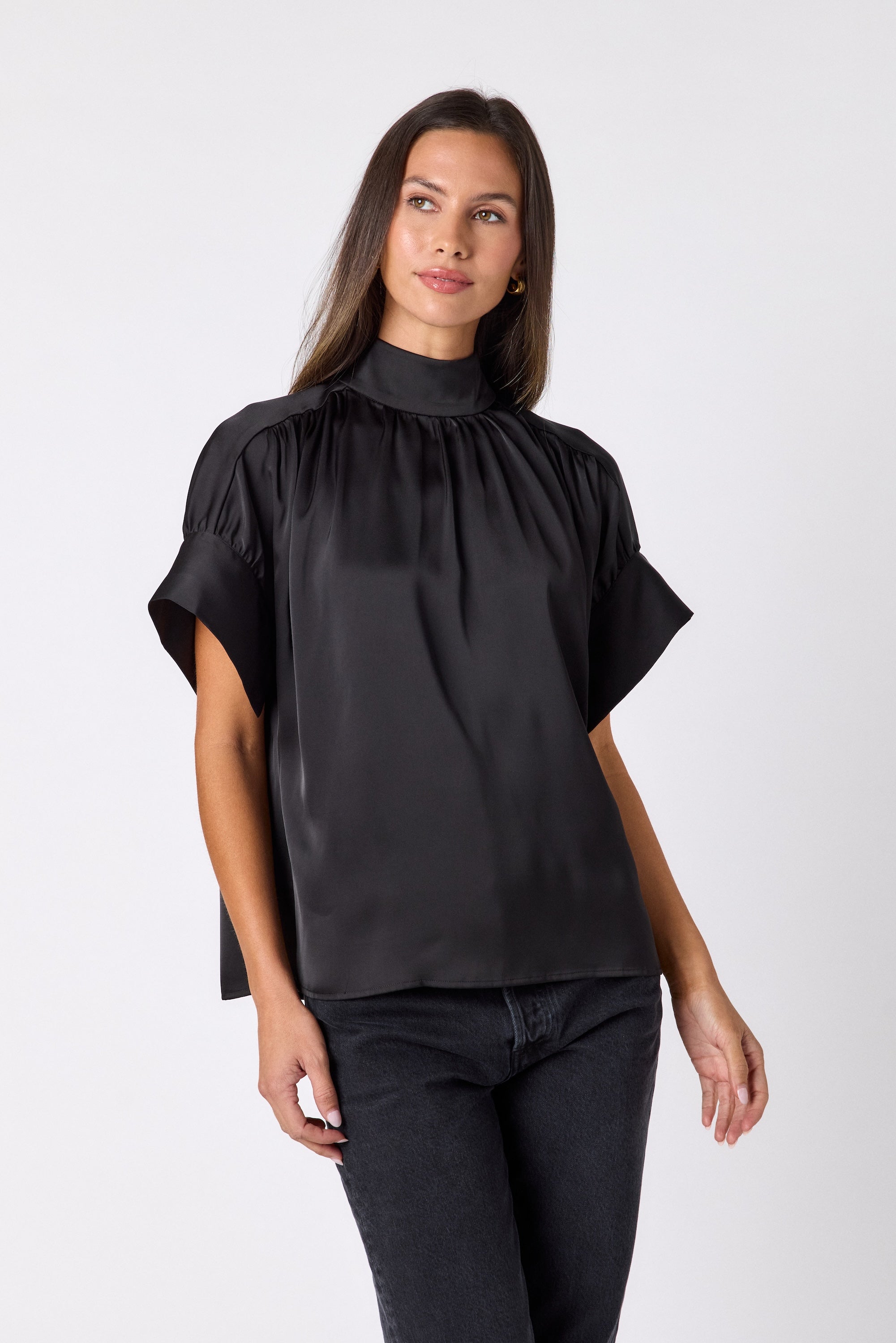 Black Lillian Top with short sleeves and versatile scarf detailing on model – CROSBY by Mollie Burch