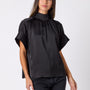 Black Lillian Top with short sleeves and versatile scarf detailing on model – CROSBY by Mollie Burch