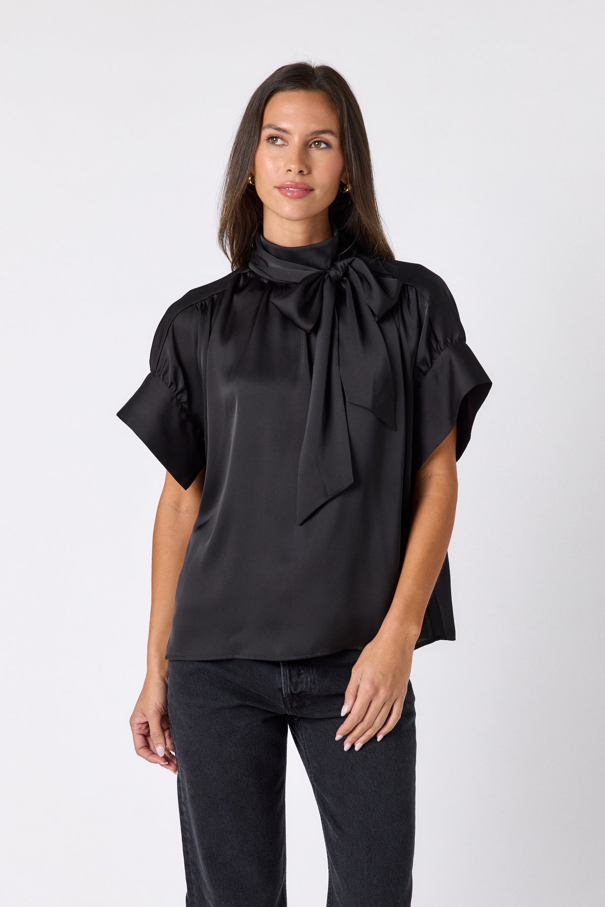 Black Lillian Top with short sleeves and versatile scarf detailing on model – CROSBY by Mollie Burch