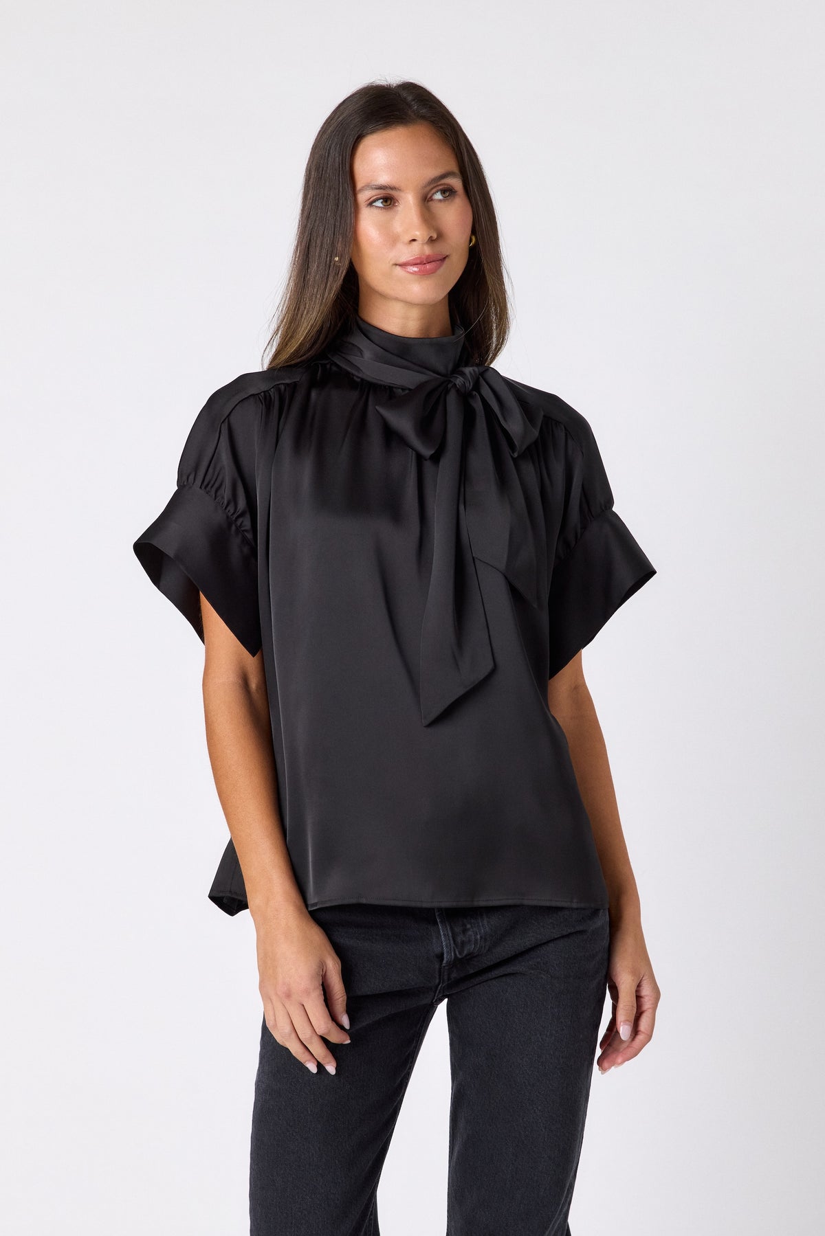 Black Lillian Top with short sleeves and versatile scarf detailing on model – CROSBY by Mollie Burch