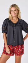 Black button front top with balloon sleeves and fagoting detail with Pheasant short on model — CROSBY by Mollie Burch