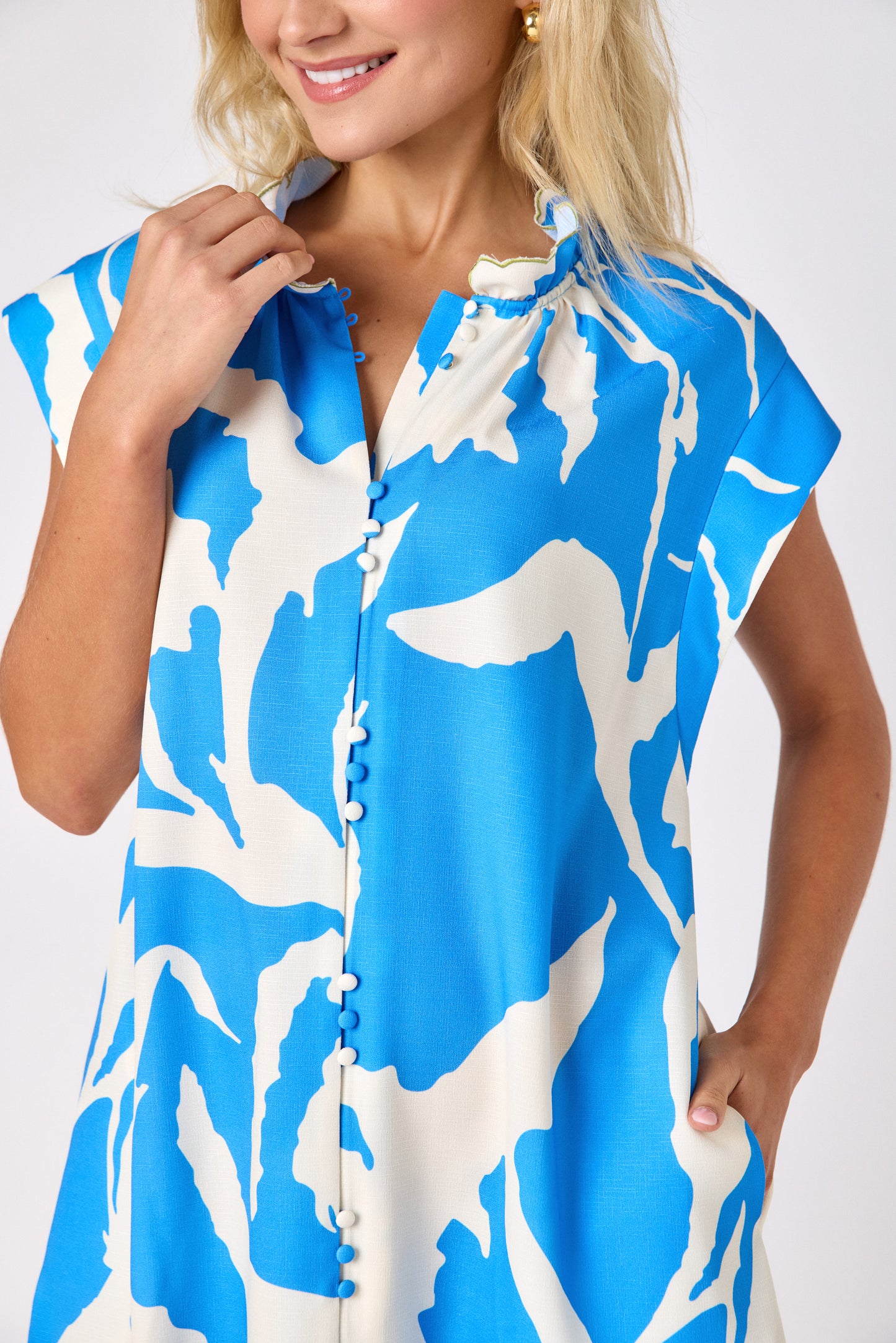 Blue Fern button-front mini dress with scallop hem on model — CROSBY by Mollie Burch