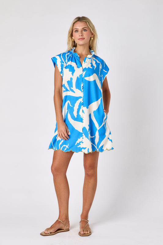 Blue Fern button-front mini dress with scallop hem on model — CROSBY by Mollie Burch