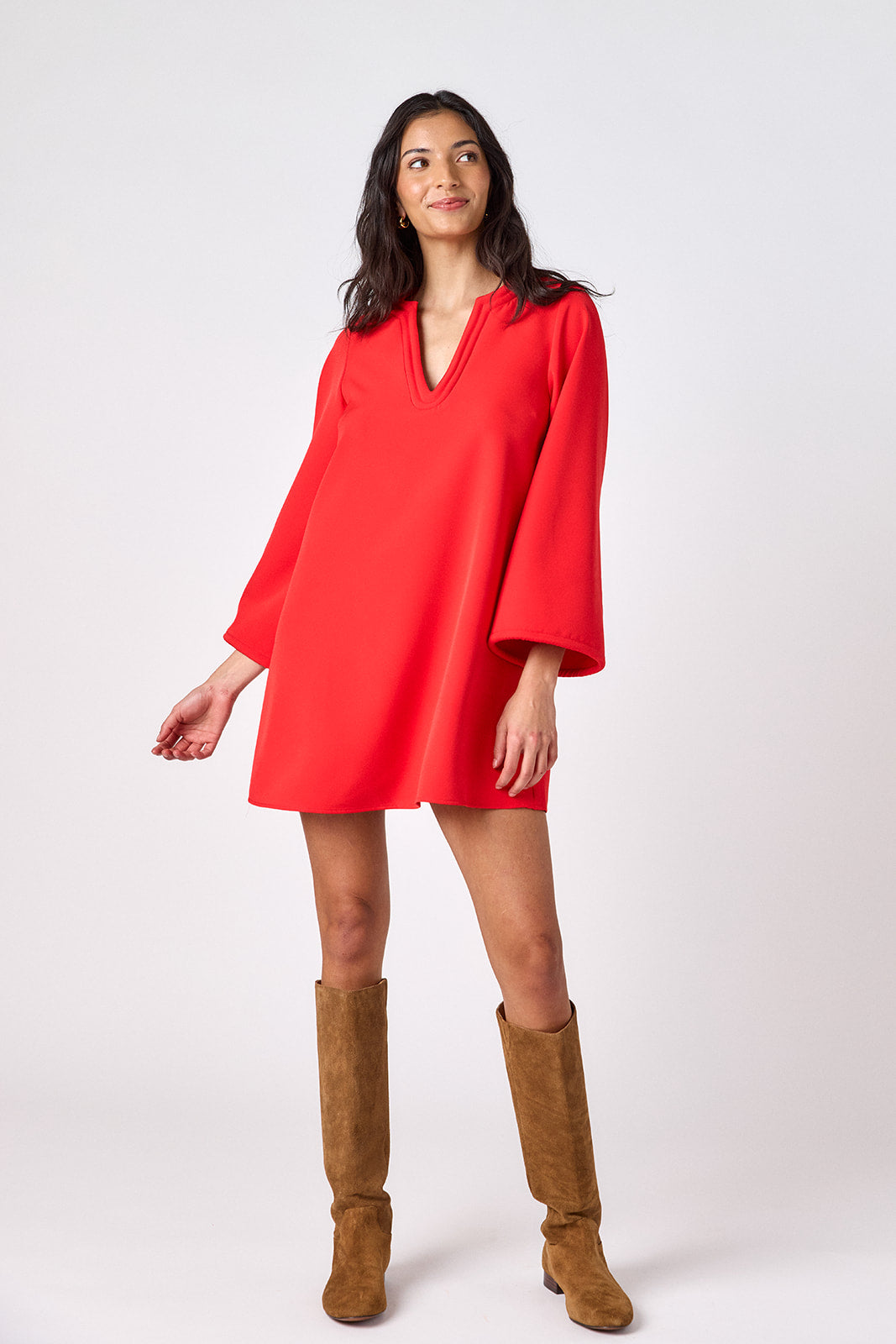 Carnelian above-the-knee tunic dress with bell sleeves on model – CROSBY by Mollie Burch