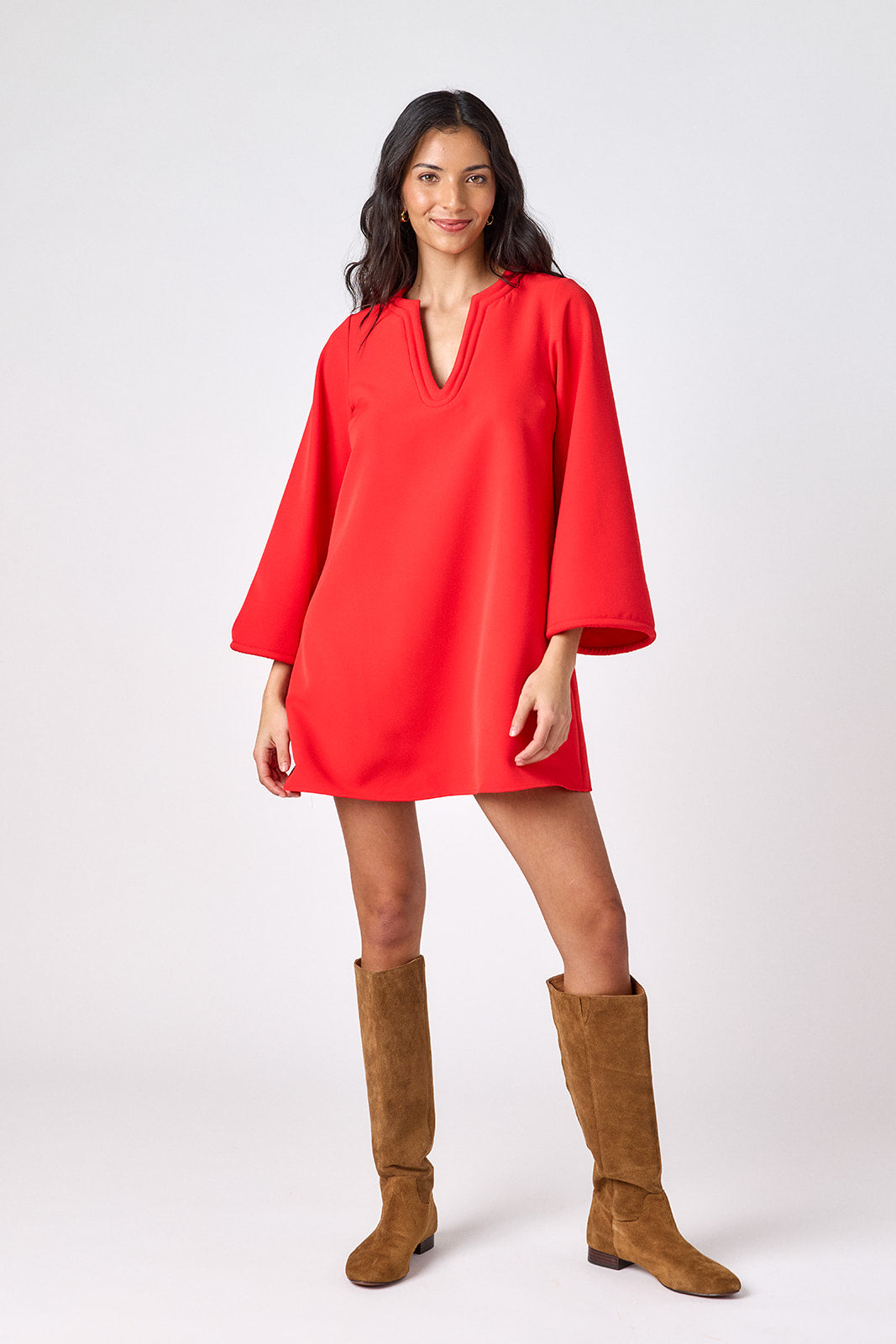 Carnelian above-the-knee tunic dress with bell sleeves on model – CROSBY by Mollie Burch
