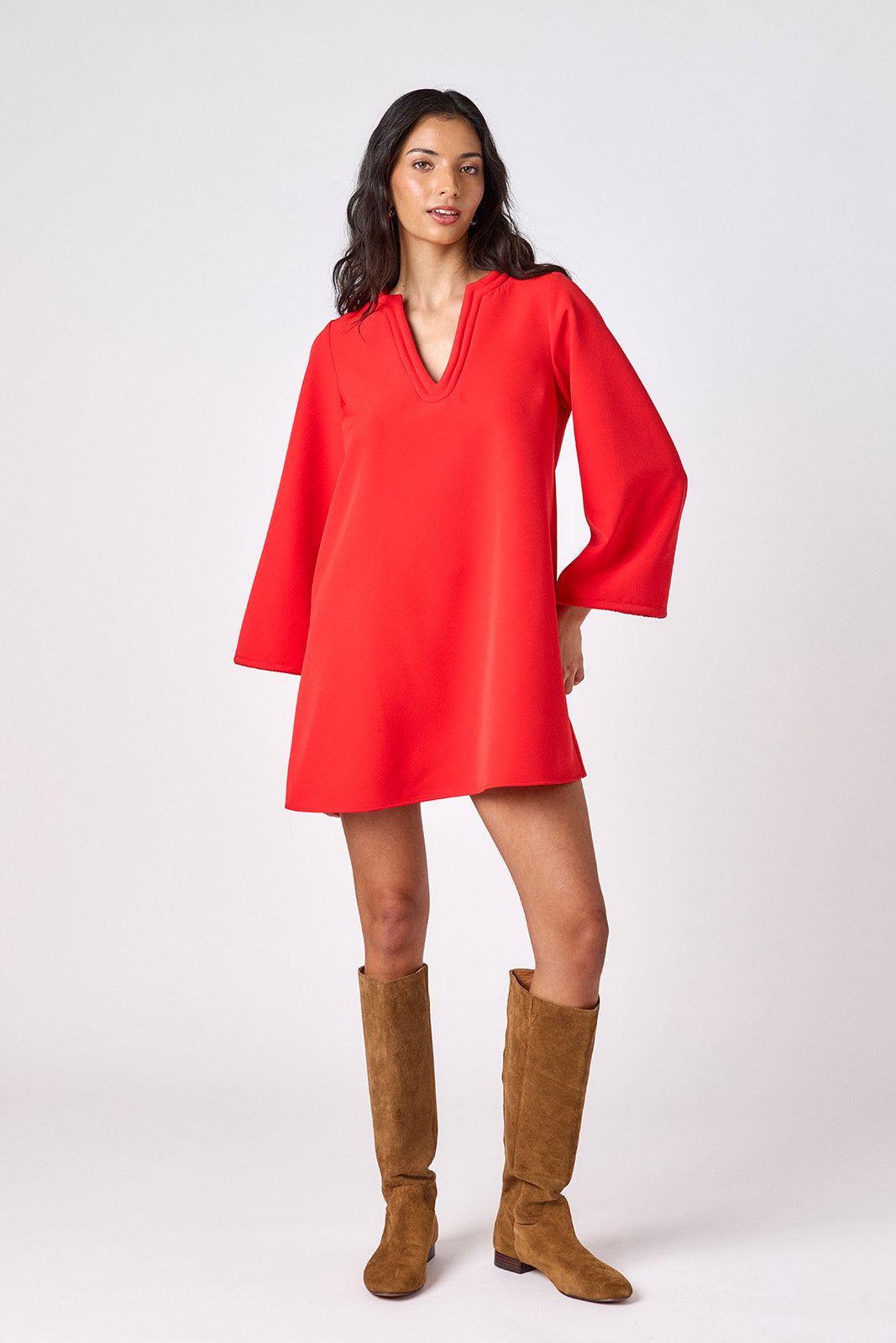 Carnelian above-the-knee tunic dress with bell sleeves on model – CROSBY by Mollie Burch