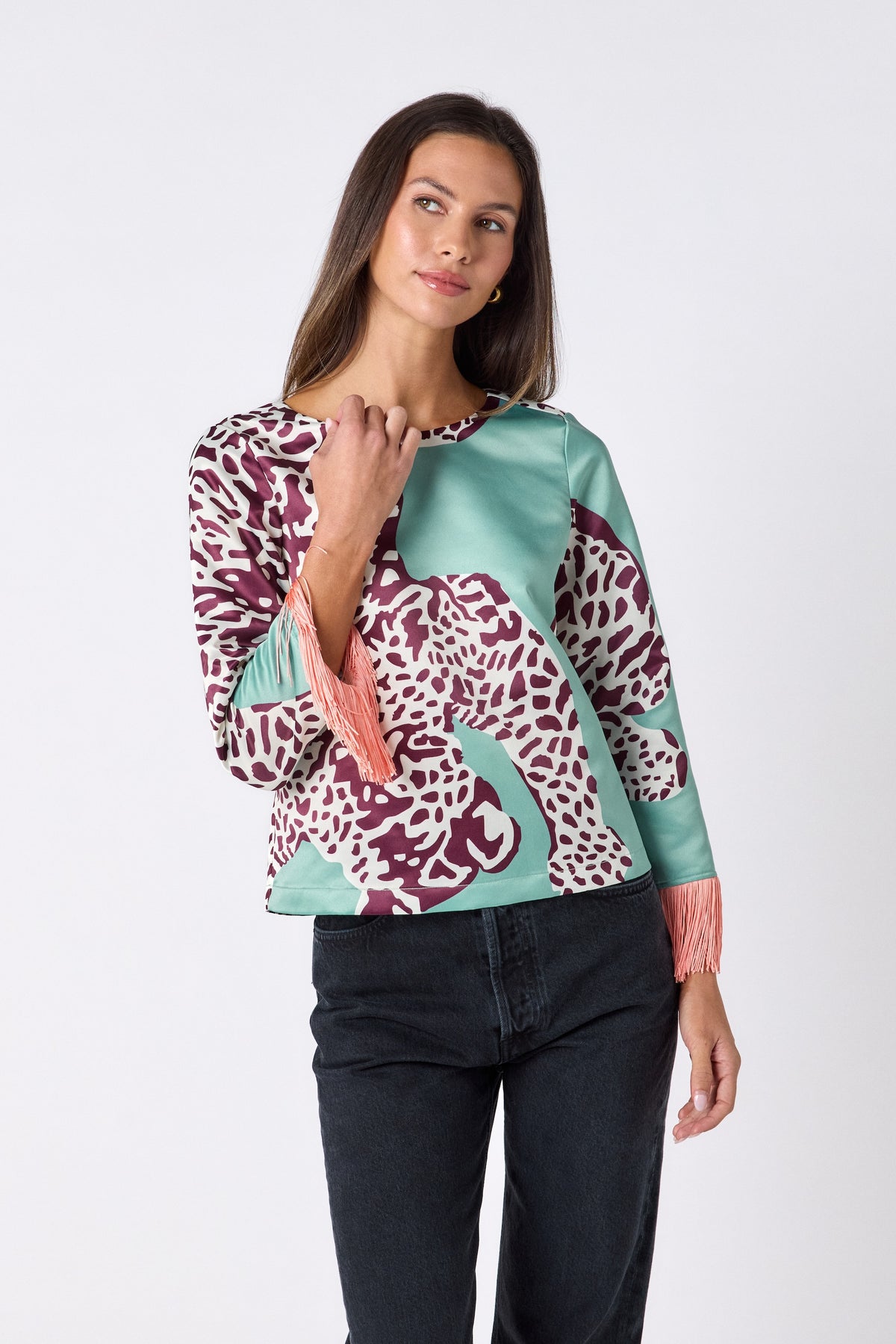 Maya Top in Mint Catwalk featuring contrast fringe sleeve cuffs and back neck tie detailing on model – CROSBY by Mollie Burch