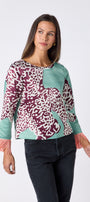 Maya Top in Mint Catwalk featuring contrast fringe sleeve cuffs and back neck tie detailing on model – CROSBY by Mollie Burch