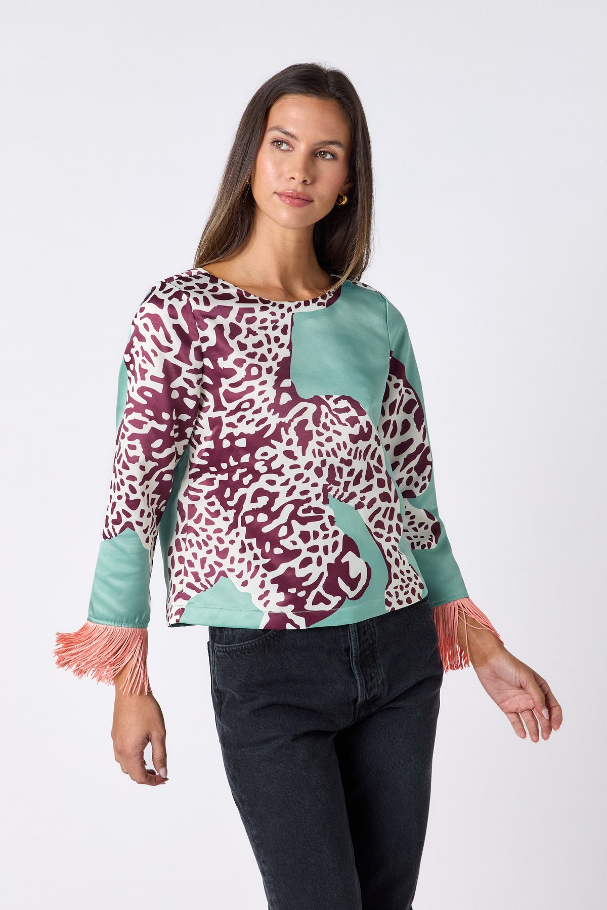 Maya Top in Mint Catwalk featuring contrast fringe sleeve cuffs and back neck tie detailing on model – CROSBY by Mollie Burch
