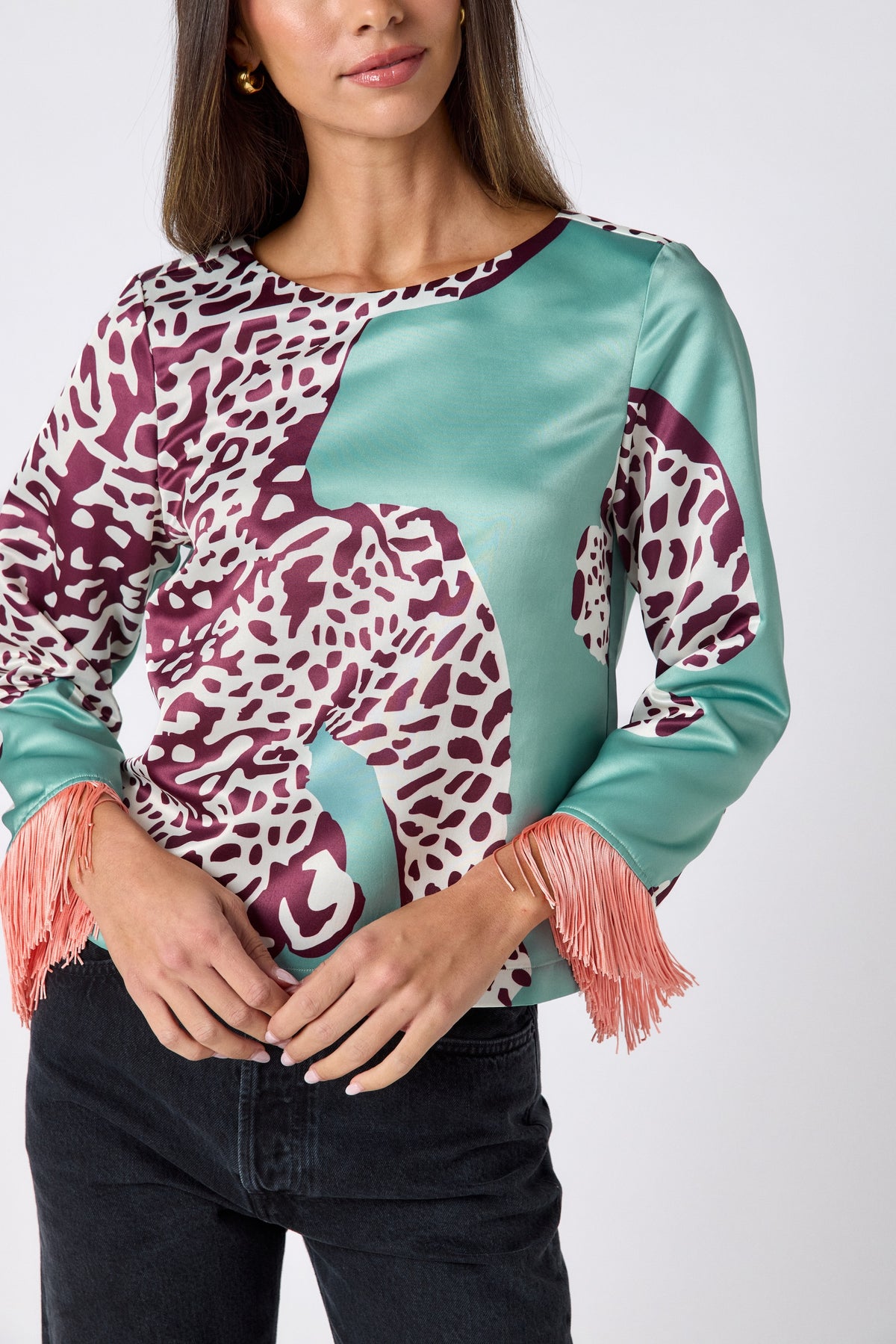 Maya Top in Mint Catwalk featuring contrast fringe sleeve cuffs and back neck tie detailing on model – CROSBY by Mollie Burch