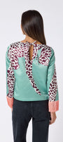 Maya Top in Mint Catwalk featuring contrast fringe sleeve cuffs and back neck tie detailing on model – CROSBY by Mollie Burch