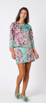 Penny Mini Skirt in Mint Catwalk featuring a bold animal-inspired print on model – CROSBY by Mollie Burch