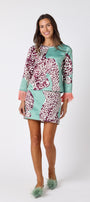 Penny Mini Skirt in Mint Catwalk featuring a bold animal-inspired print on model – CROSBY by Mollie Burch