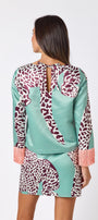 Penny Mini Skirt in Mint Catwalk featuring a bold animal-inspired print on model – CROSBY by Mollie Burch