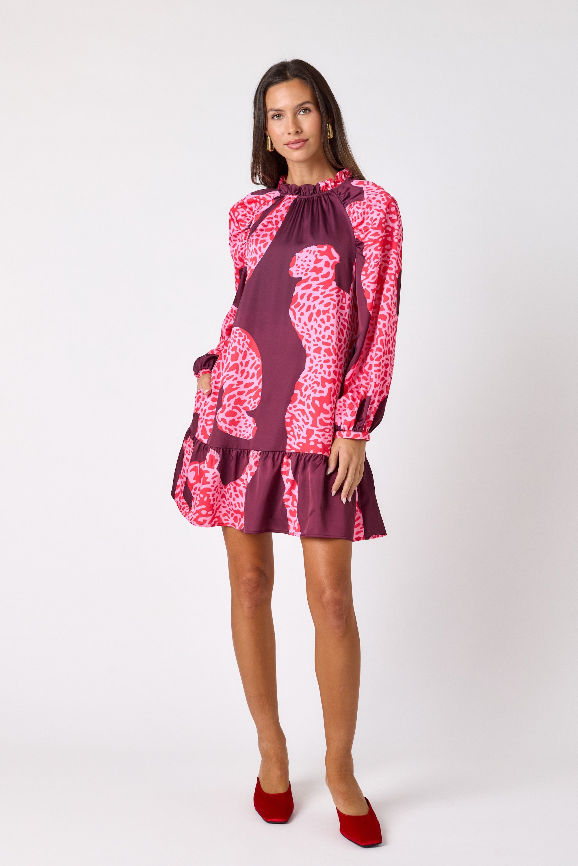 Flynn Dress in Pink Catwalk featuring puff sleeves, ruffle detailing, and a colorful animal print on model – CROSBY by Mollie Burch