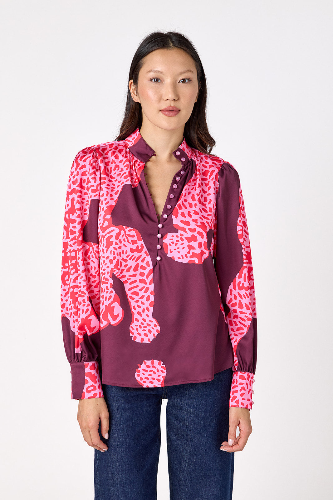 Leland Blouse in Pink Catwalk featuring puff sleeves and gold-rimmed buttons on model – CROSBY by Mollie Burch