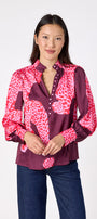 Leland Blouse in Pink Catwalk featuring puff sleeves and gold-rimmed buttons on model – CROSBY by Mollie Burch
