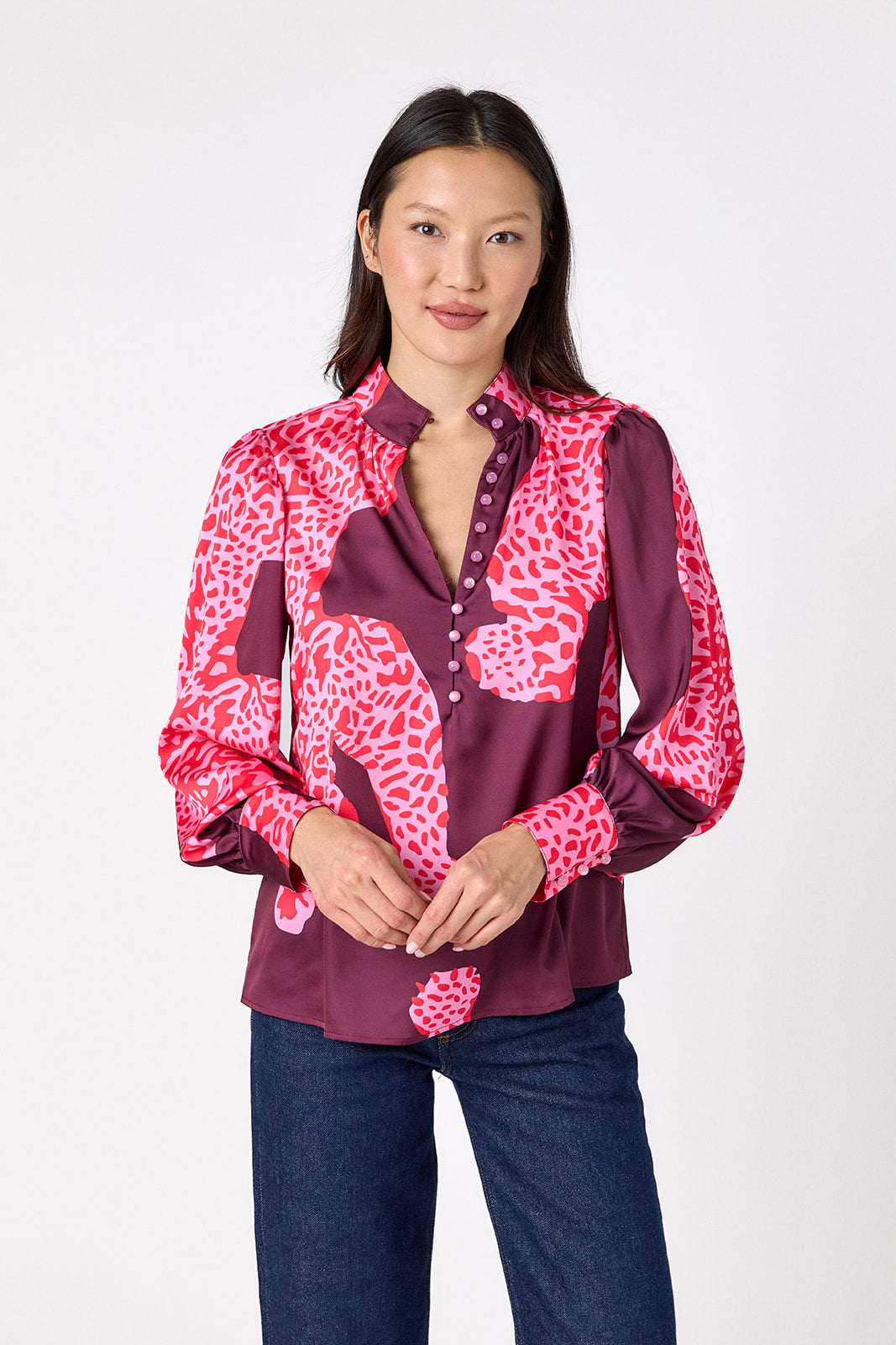 Leland Blouse in Pink Catwalk featuring puff sleeves and gold-rimmed buttons on model – CROSBY by Mollie Burch