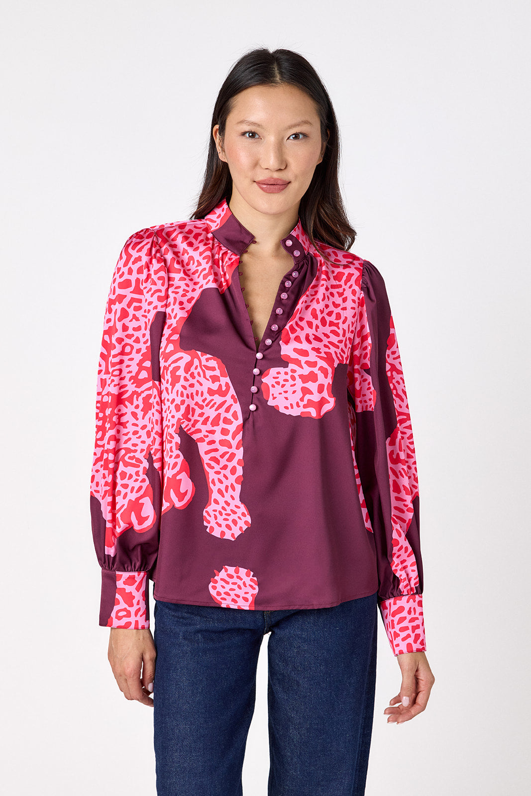 Leland Blouse in Pink Catwalk featuring puff sleeves and gold-rimmed buttons on model – CROSBY by Mollie Burch