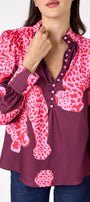 Leland Blouse in Pink Catwalk featuring puff sleeves and gold-rimmed buttons on model – CROSBY by Mollie Burch