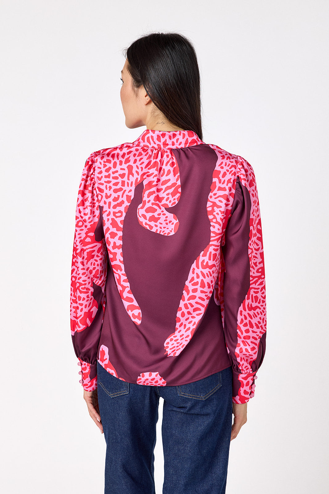 Leland Blouse in Pink Catwalk featuring puff sleeves and gold-rimmed buttons on model – CROSBY by Mollie Burch