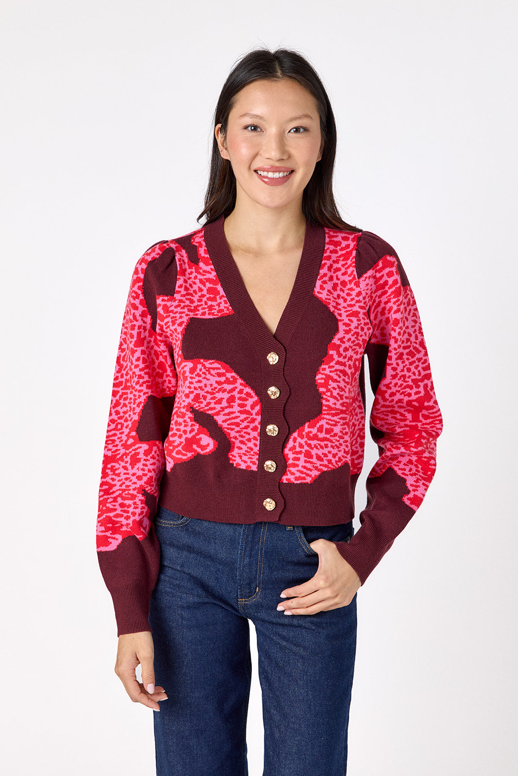 Catwalk Pink v-neck cardigan with scallop detail on model – CROSBY by Mollie Burch