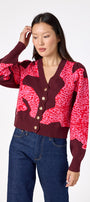 Catwalk Pink v-neck cardigan with scallop detail on model – CROSBY by Mollie Burch