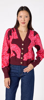 Catwalk Pink v-neck cardigan with scallop detail on model – CROSBY by Mollie Burch