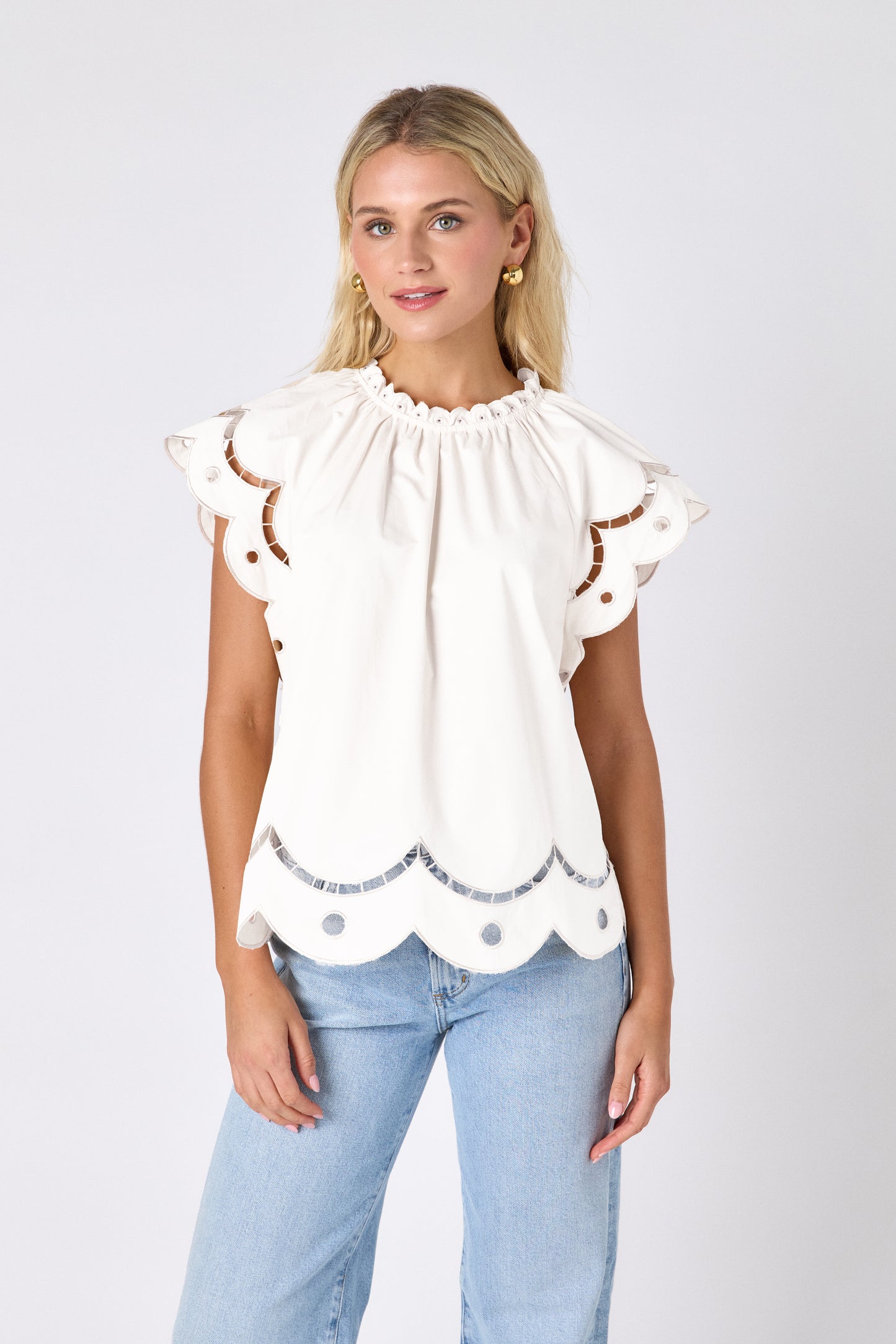 Cream raglan style short sleeve top with fagoting and scallop details on model — CROSBY by Mollie Burch