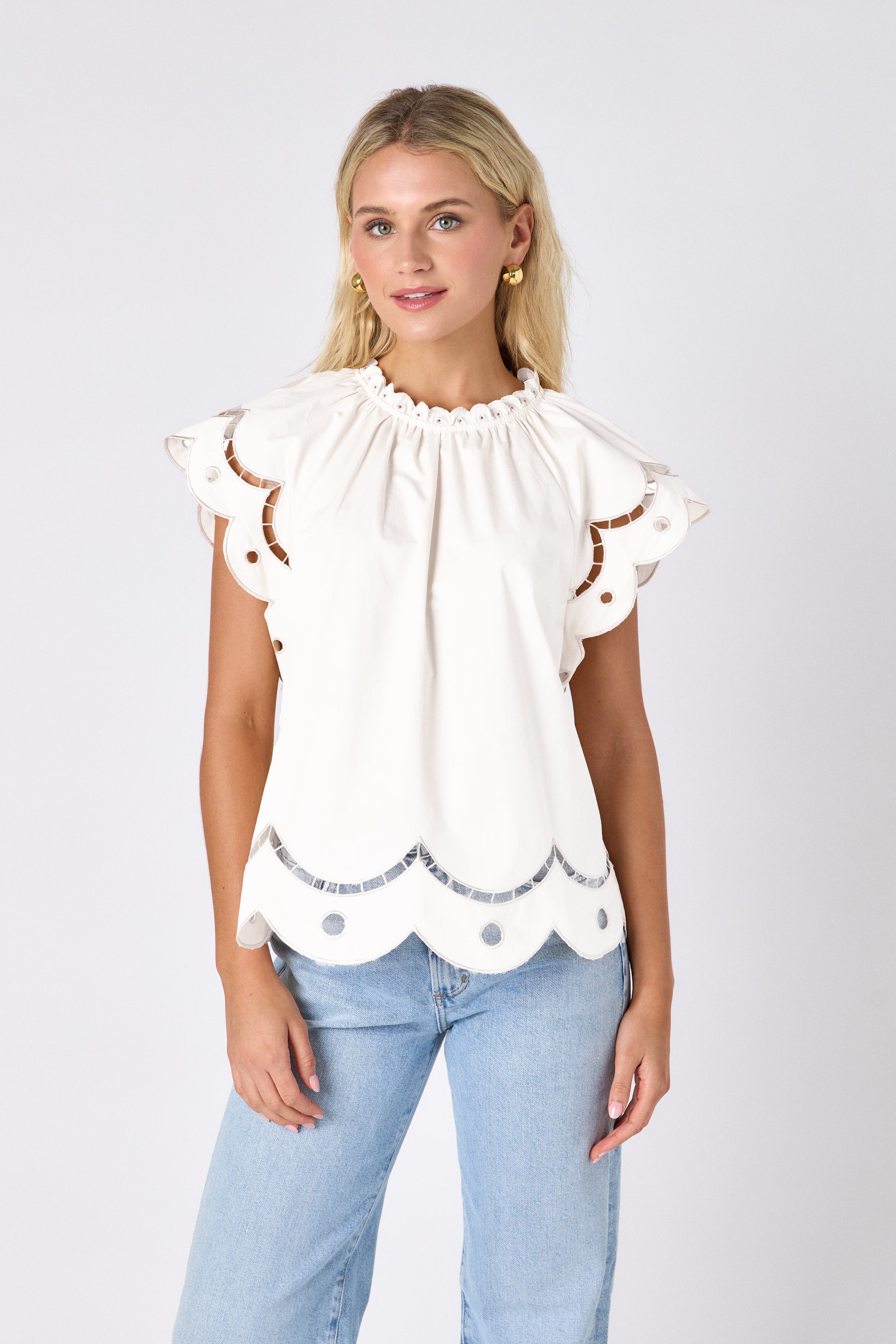 Cream raglan style short sleeve top with fagoting and scallop details on model — CROSBY by Mollie Burch