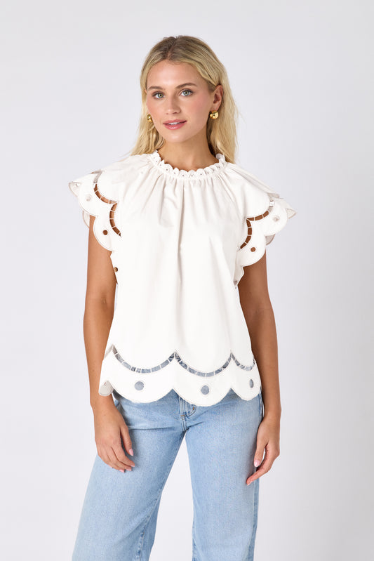 Cream raglan style short sleeve top with fagoting and scallop details on model — CROSBY by Mollie Burch
