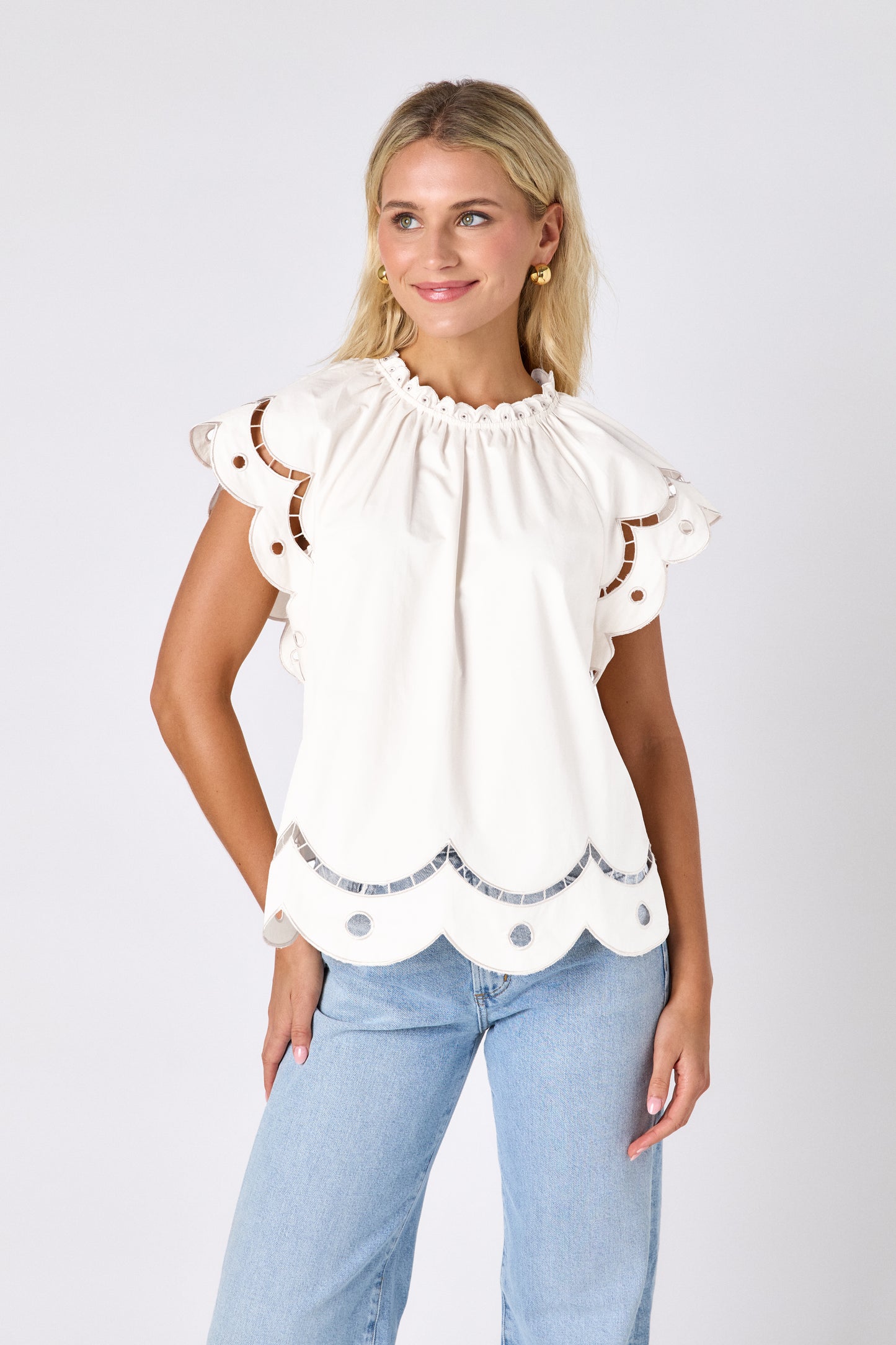 Cream raglan style short sleeve top with fagoting and scallop details on model — CROSBY by Mollie Burch